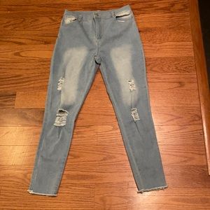 Distressed Jeans With Frayed Bottom